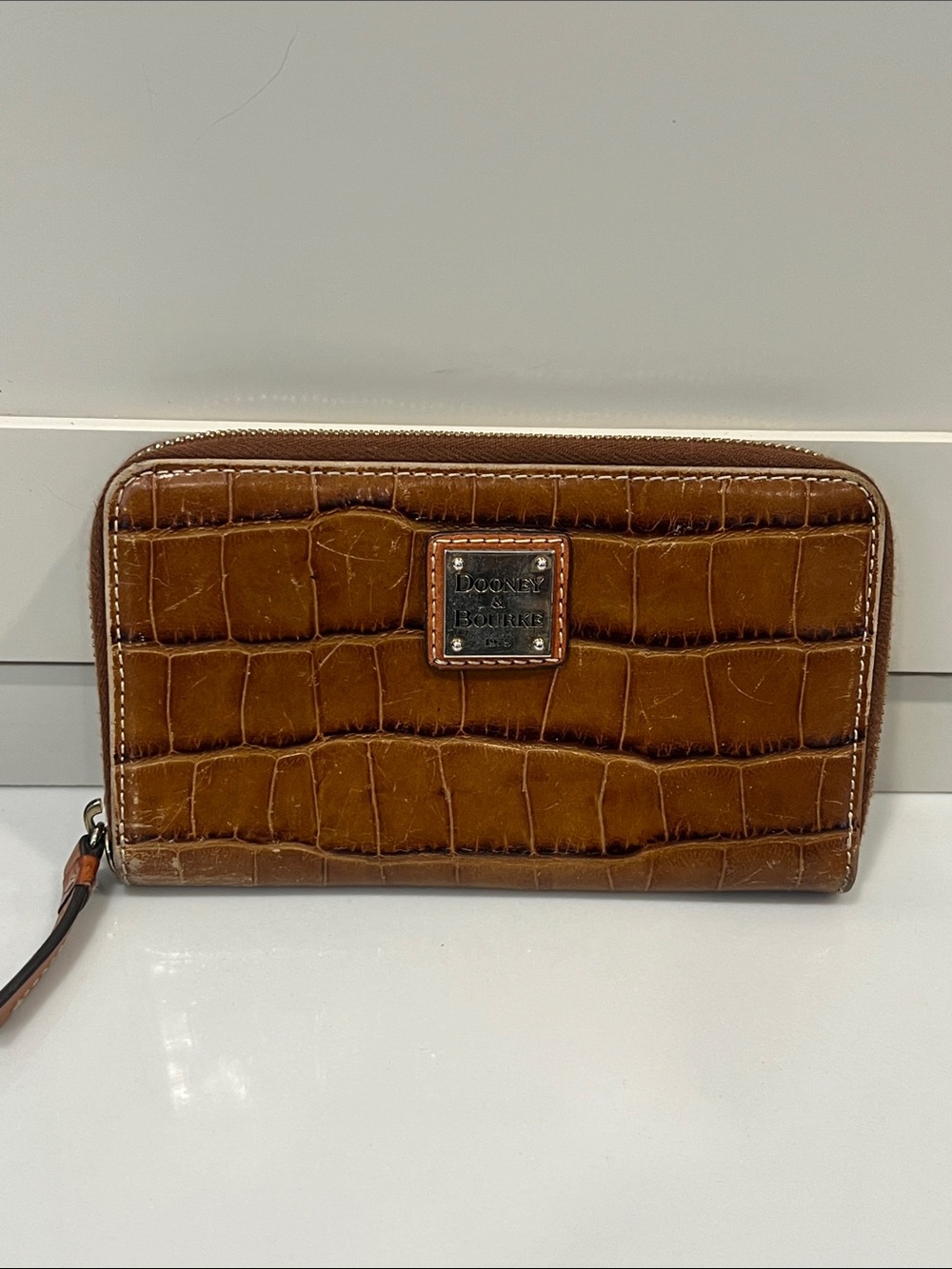 Dooney & Bourke Croc-Embossed Zip Wristlet in Cognac